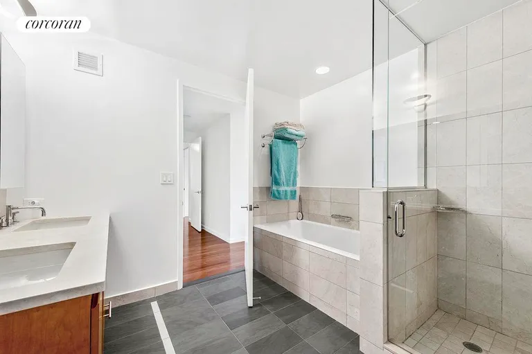 New York City Real Estate | View 255 Hudson Street, PHE | Master bathroom with double sink,tub and shower | View 7