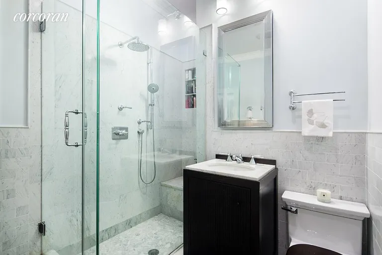 New York City Real Estate | View 92 Horatio Street, 1L | Carerra marble bathroom with glass enclosed shower | View 5