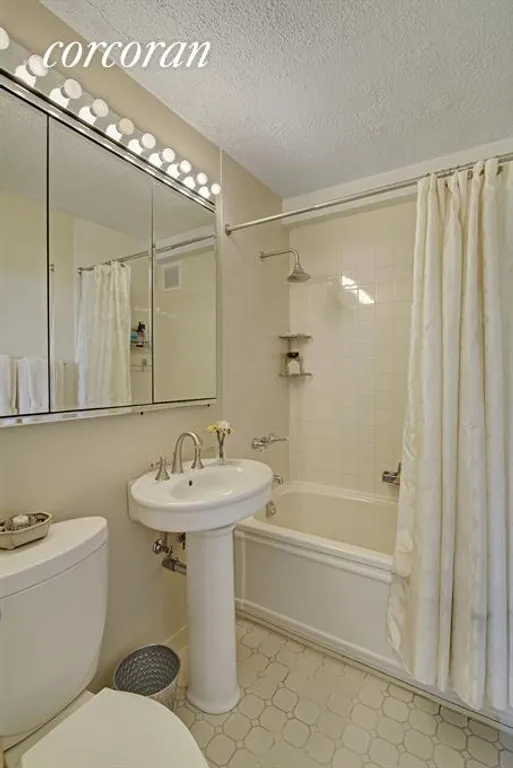 New York City Real Estate | View 115 East 87th Street, 39E | Master Bathroom is sparkling white. | View 8