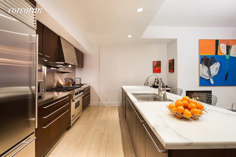 New York City Real Estate | View 150 Nassau Street, 10A | Expansive chef's kitchen with marble countertop | View 3