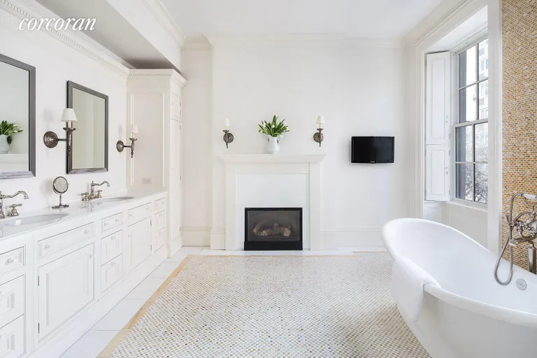 New York City Real Estate | View 60 West 9th Street | Masterbath Deep Soaking tub next to the fireplace | View 7