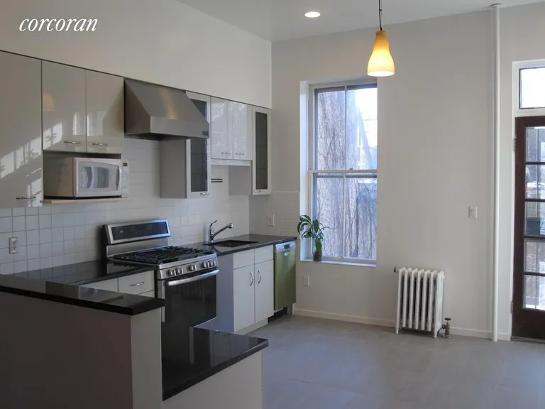 New York City Real Estate | View 248 Dean Street, 2 | Eat-In Kitchen w/ new appliances and door to deck | View 3