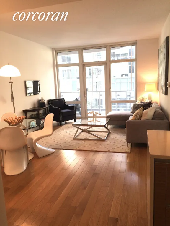New York City Real Estate | View 555 West 59th Street, 5G | 21 x 13 Living Room with floor to ceiling windows | View 8