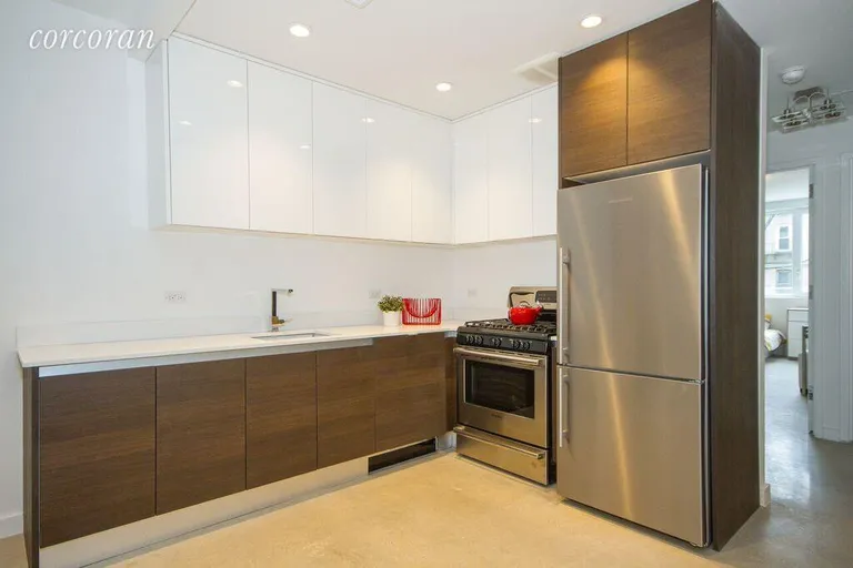 New York City Real Estate | View 834 Sterling Place, 303 | Open Chefs kit w/camouflage paneled dishwasher
 | View 3