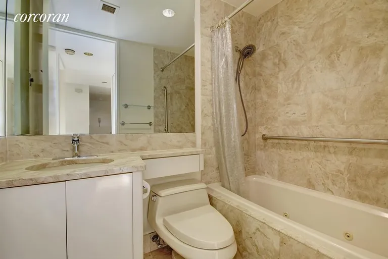 New York City Real Estate | View 100 United Nations Plaza, 21D | Marble Bathroom with Jacuzzi Tub | View 4