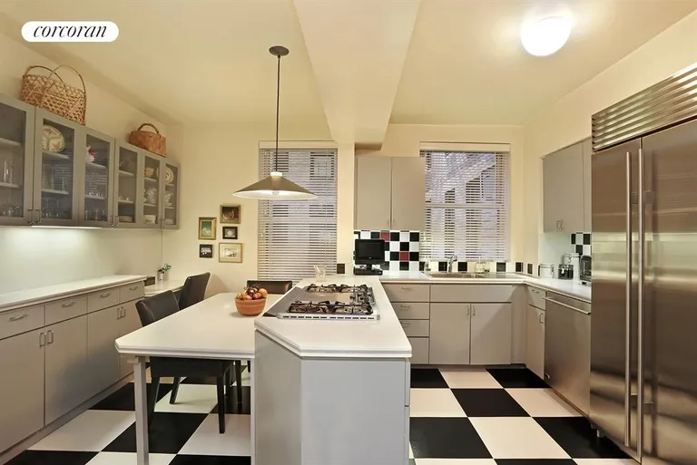 New York City Real Estate | View 47 East 88th Street, 3B | Kitchen with center island and top appliances | View 4