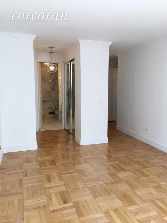 New York City Real Estate | View 308 East 72Nd Street, 12C | Master Bedroom looking into Bathroom | View 6