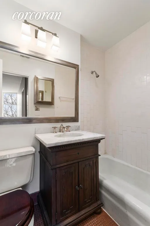 New York City Real Estate | View 214 Riverside Drive, 205 | Updated White Tile Bathroom | View 4