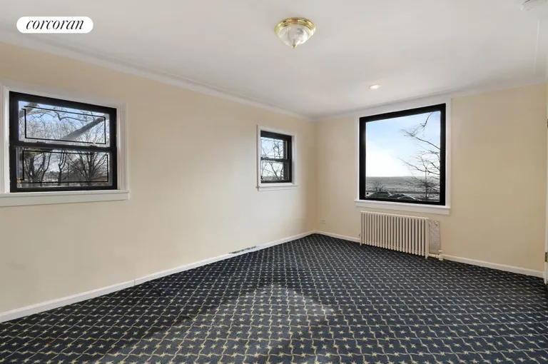 New York City Real Estate | View 1177 Shore Parkway | Sunswept Living Room w/ Large Windows & Water View | View 9