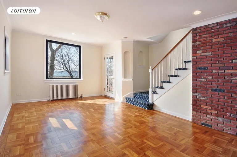 New York City Real Estate | View 1177 Shore Parkway | Sunswept Living Room w/Large Windows & Water Views | View 13