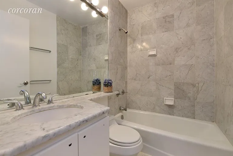New York City Real Estate | View 45 East 25th Street, 8C | Sparkling bathroom in white Carrera marble! | View 4