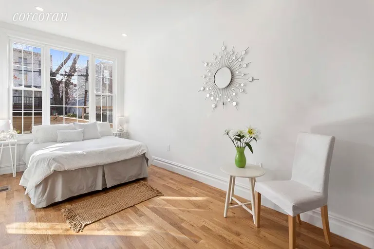 New York City Real Estate | View 1036 Madison Street | Master bedroom with oversized windows | View 4