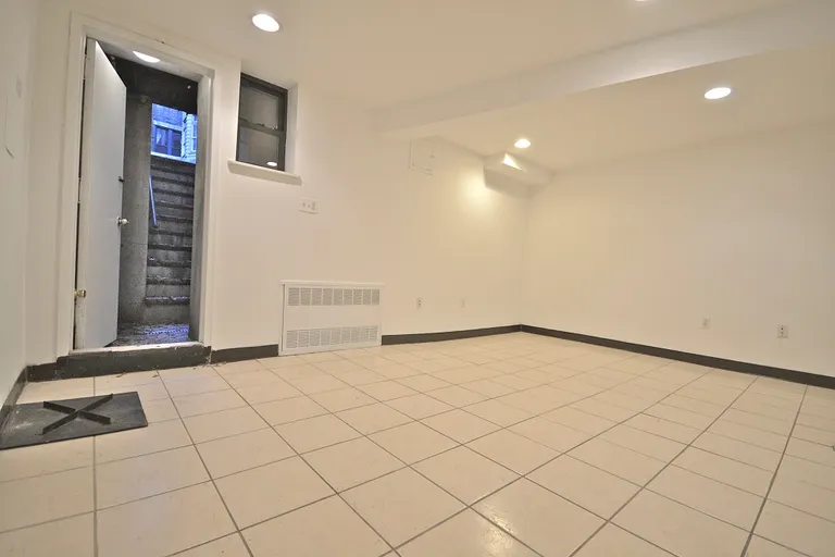 New York City Real Estate | View 66 West 69th Street, 1 | Downstairs living area w/garden access! | View 5