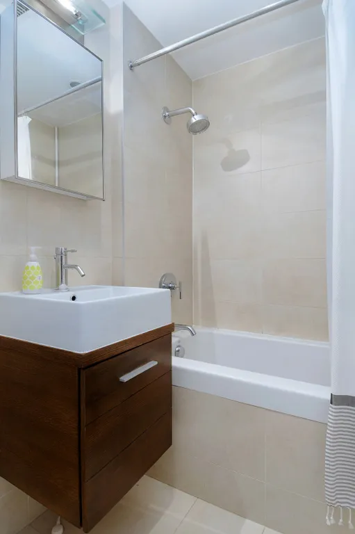 New York City Real Estate | View 133 Water Street, 11D | Bath with deep soaking tub and floating vanity | View 4