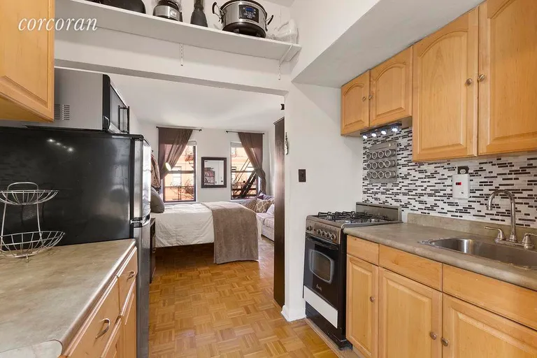 New York City Real Estate | View 512 East 83rd Street, 4A | 4 Kitchen looking into Living Area | View 4