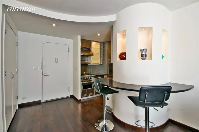 New York City Real Estate | View 61 West 62Nd Street, 23H | U Shaped Breakfast Bar outside Kitchen | View 3