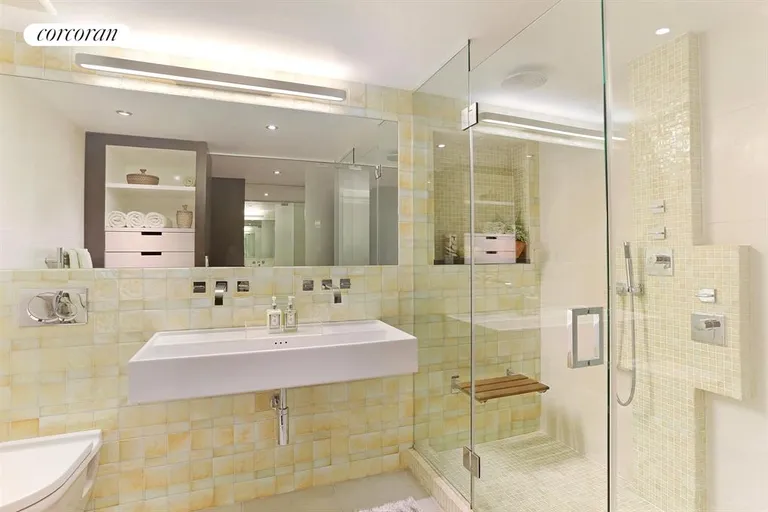 New York City Real Estate | View 23 Waverly Place, 4I | Luxury bath with drawers, shelves and a hamper!  | View 5