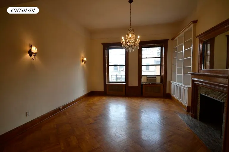 New York City Real Estate | View 38 West 69th Street, 4A | Decorative fireplace and beautiful Chandelier | View 6