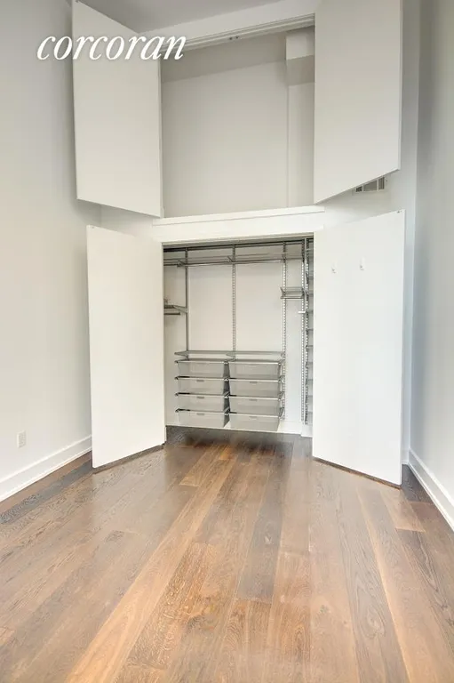 New York City Real Estate | View 390 Lorimer Street, 3D | Custom closet with deep storage overhead | View 4
