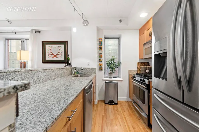 New York City Real Estate | View 53 Boerum Place, 9J | Open and Windowed Kitchen with New Fridge | View 3