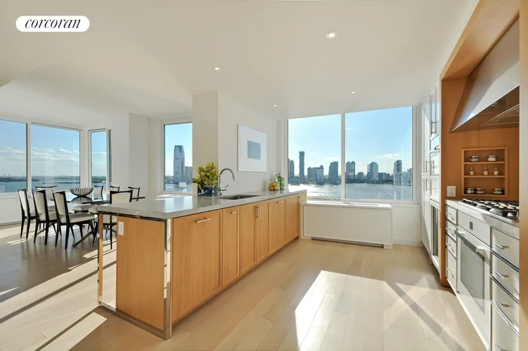 New York City Real Estate | View 212 Warren Street, 17C | Enjoy sunset views from the open kitchen   | View 5