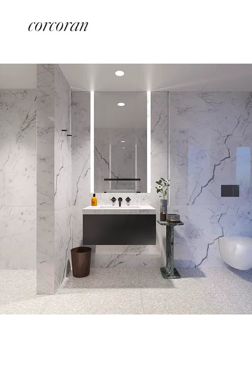 New York City Real Estate | View 16 West 40th Street, 29A | Secondary Bath and Powder Room Clad in Marble | View 5