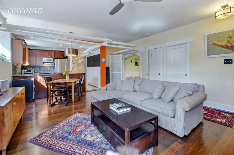 New York City Real Estate | View 186 Prospect Park West, A | Living room with open kitchen beyond | View 2
