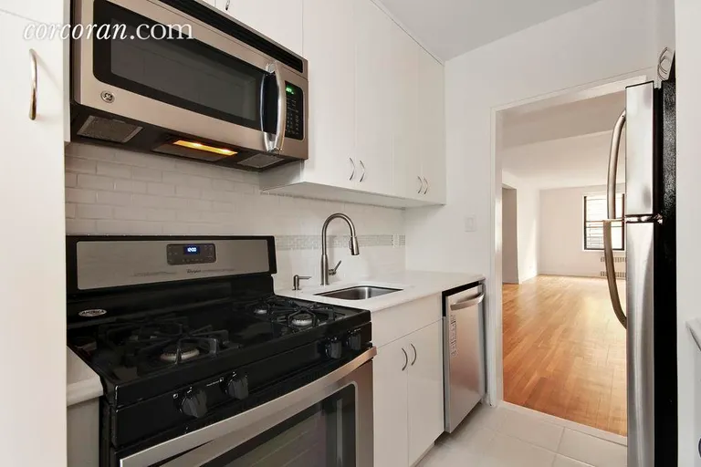 New York City Real Estate | View 30 East 9th Street, 5G | Renovated windowed kitchen | View 3