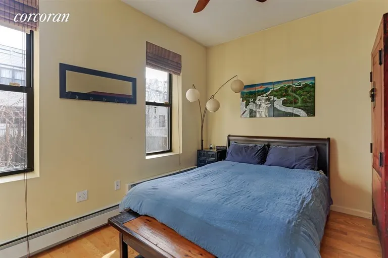 New York City Real Estate | View 1060 Putnam Avenue, 1R | Master Bedroom with a view to the garden! | View 3
