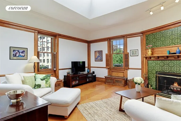 New York City Real Estate | View 101 8th Avenue, 9 | Corner Living Room with wood-burning fireplace | View 3