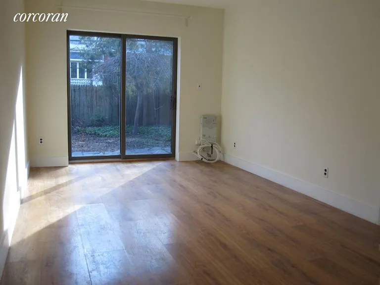 New York City Real Estate | View 366 Pacific Street, 1 | Living Room with direct access to garden | View 4