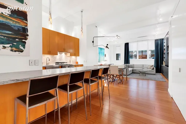New York City Real Estate | View 233 West 26th Street, 1E | Breakfast Bar for entertaining while you cook! | View 4