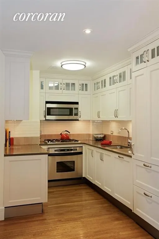 New York City Real Estate | View 27 West 72nd Street, 1407 | Open custom kitchen w/ top of the line appliances | View 2