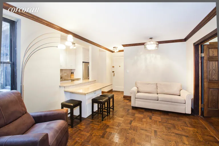 New York City Real Estate | View 208 East 70th Street, 1AB | Granite Breakfast Bar Comfortably Seats Four. | View 2