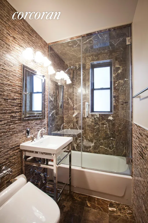 New York City Real Estate | View 208 East 70th Street, 1AB | Silver Screened Marble with Glass Enclosed Tub. | View 5