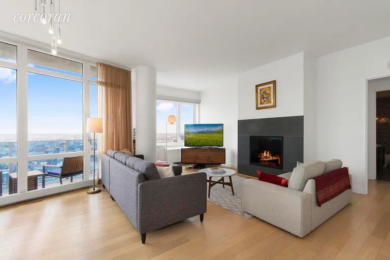 New York City Real Estate | View 22 North 6th Street, PH1E | Fire place, balcony & floor-to-ceiling windows | View 2