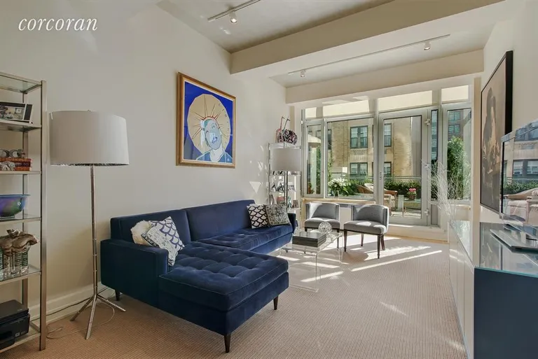 New York City Real Estate | View 110 Livingston Street, 8R | Living Room with high beamed ceilings and terrace | View 2