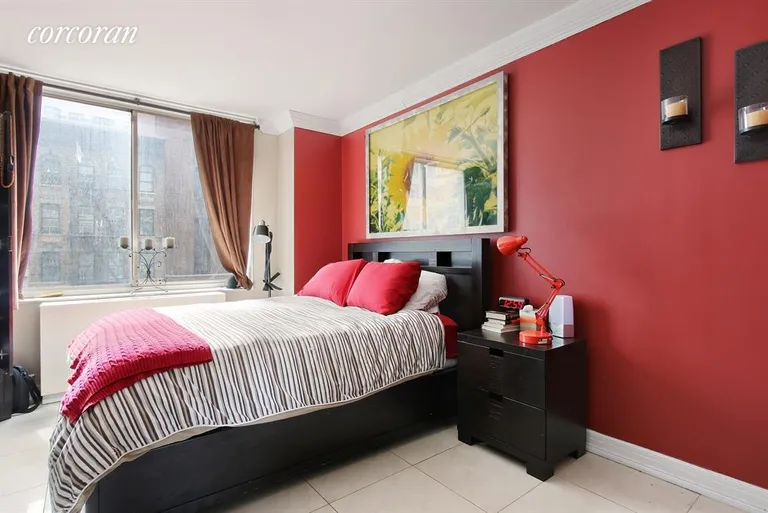 New York City Real Estate | View 220 East 65th Street, 5D | Large bedroom w/ decorative molding & tile floors | View 2