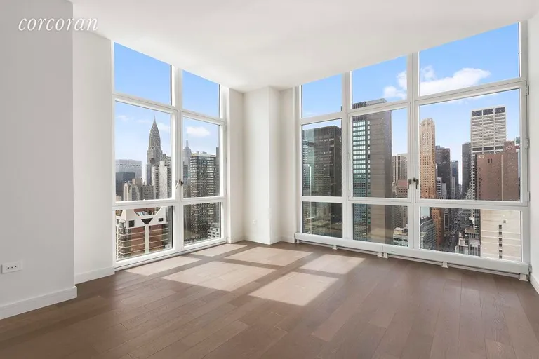 New York City Real Estate | View 305 East 51st Street, 31A | Master Bedroom: Views of Empire   & Chrysler Bldg  | View 4