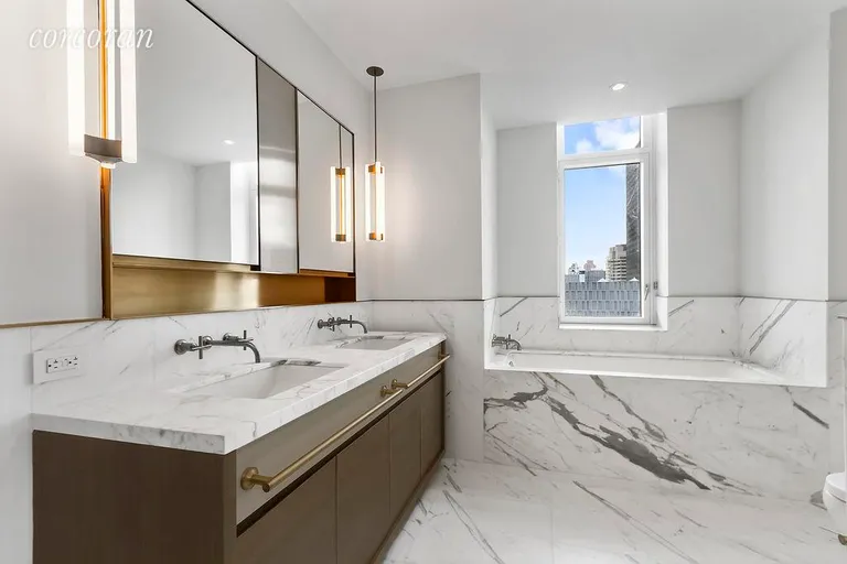 New York City Real Estate | View 305 East 51st Street, 31A | Luxurious Master Bath with tub and stall shower.  | View 8