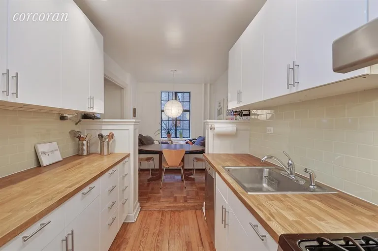 New York City Real Estate | View 116 Pinehurst Avenue, D33 | Kitchen with attached dining and banquette | View 2