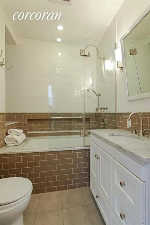 New York City Real Estate | View 25 Garden Place, 3 | One of two beautifully renovated bathrooms | View 6