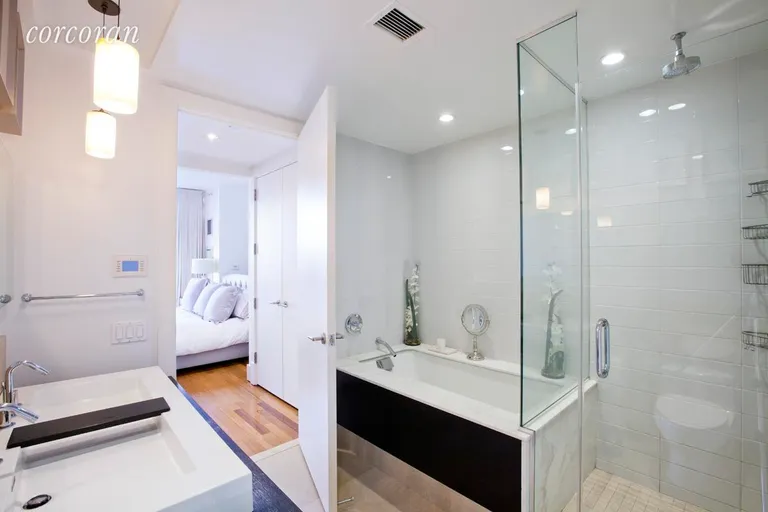 New York City Real Estate | View 163 West 18th Street, 3A | Dual sinks with storage and a deep soaking tub | View 5