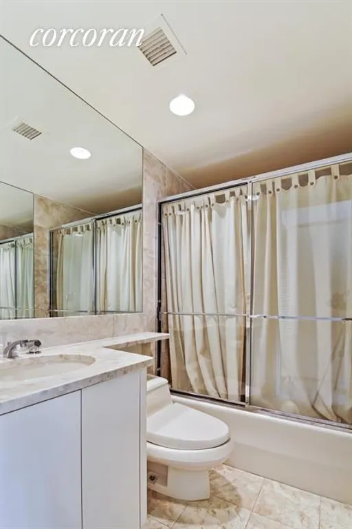 New York City Real Estate | View 100 United Nations Plaza, 28B | Marble Bathroom in 2nd Bedroom | View 4