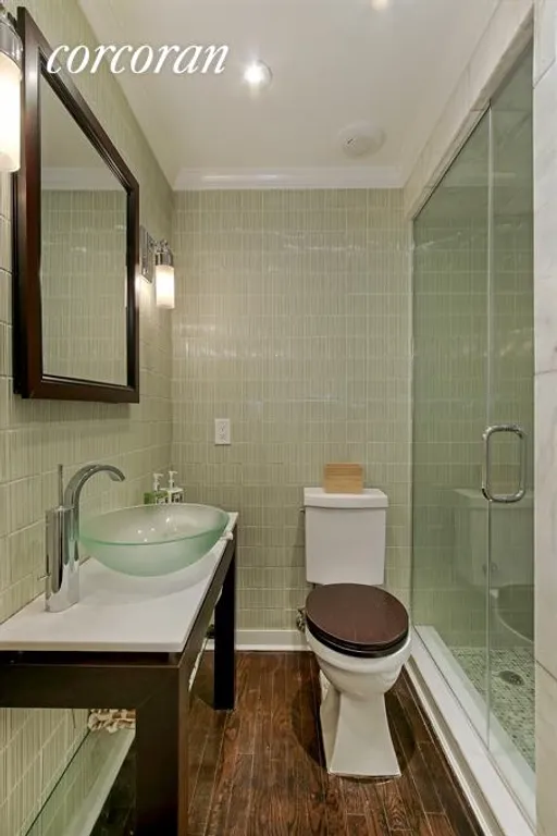 New York City Real Estate | View 333 East 43rd Street, 721 | Renovated master bath with steam shower | View 5