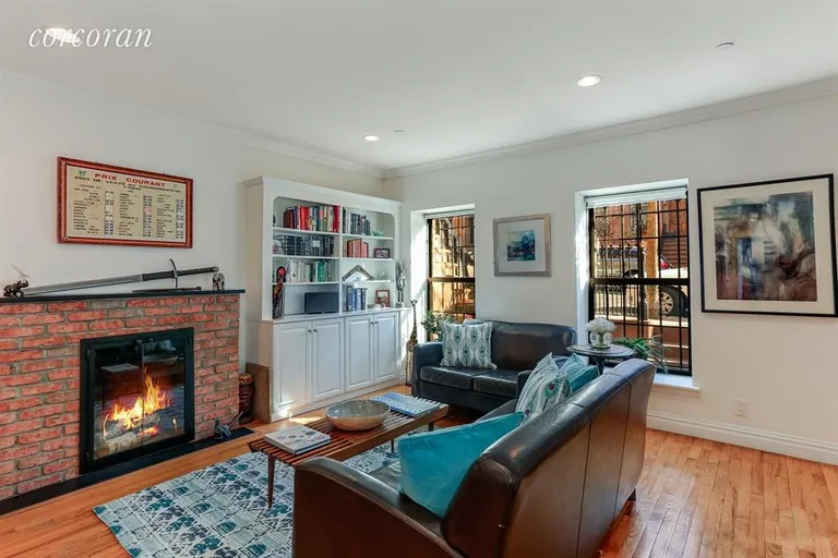 New York City Real Estate | View 41 Park Place, 1 | Spacious Living Room With Wood-burning Fireplace | View 3