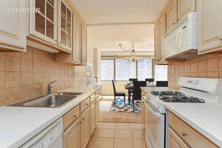 New York City Real Estate | View 315 West 70th Street, 9L | Kitchen into Dining Virtually Staged | View 7