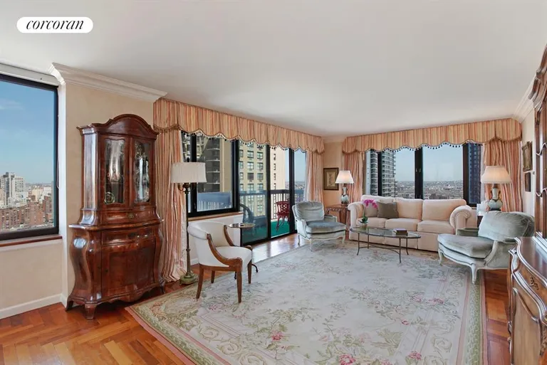 New York City Real Estate | View 422 East 72nd Street, 30A | Expansive corner living room with private balcony | View 2