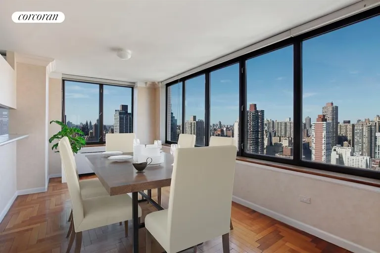 New York City Real Estate | View 422 East 72nd Street, 30A | Dining room with open western and northern views | View 3