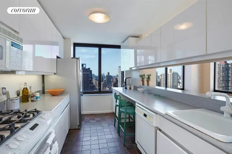 New York City Real Estate | View 422 East 72nd Street, 30A | Huge open kitchen with magnificent window | View 5